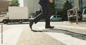 Legs, walking and business person on crossing, travel in city with street, carbon footprint and buildings with and bag. Eco friendly commute to work, urban CBD and shoes for corporate journey