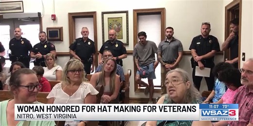 Woman honored for making hats for veterans