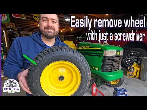How to easily remove a wheel from a John Deere lawn tractor using basic tools