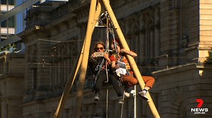Peak-hour traffic in the heart of the CBD has ground to a halt for the second time in a week after Extinction Rebellion protesters shut down part of Victoria Square with a makeshift bamboo tripod. Three protesters were arrested after STAR Group officers were called in to remove them from their stunt. The latest in Adelaide’s only morning news service in 7NEWS Adelaide at 11.30am | More local news: www.7NEWS.com.au/news/sa #7NEWS | 7NEWS Adelaide