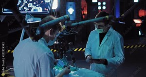 Young scientists do an autopsy of a space alien. You can see the entrails of the body of an alien. Autopsy is performed using surgical instruments and equipment.