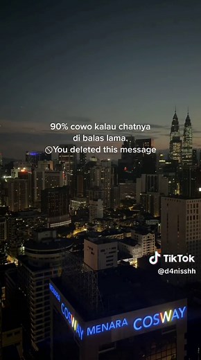 Nighttime Cityscape with COSWAY Signage