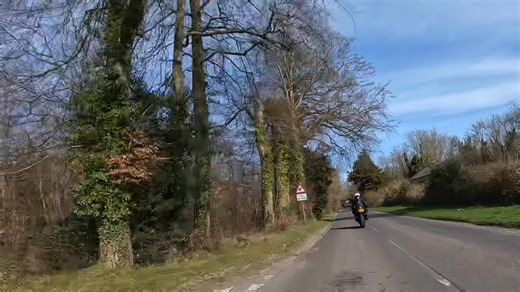 Right Bend followed by a crossroads. Rider by using the system of IPSGA the rider has adopted the correct position, speed and gear for the bend. By doing so is able to see the car in the left junction of the crossroads. Therefore if the car were to pull out the rider should be able to stop in the distance he sees to be clear. Luckily the car stayed where it was. | Younique Advanced Motorcycling