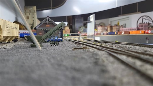 A CSX maintenance train rumbles by the Oxford depot. | Suncoast Model Railroad Club