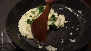 Preparing a scrumptious omelette using a frying pan,tasty breakfast