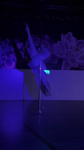 Captivating Blacklight Pole Dance Performance