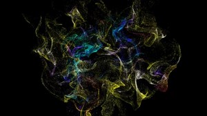 Yellow moving background particles. Slow motion of flying colorful particles with glow effects. Dust particles fly on a black background. 4k video, motion design