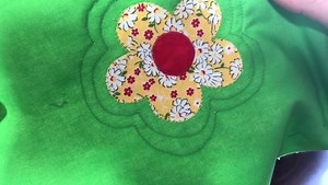 Attach the Free Motion Echo Quilting Foot and drop the machine feed dogs. Use the intersecting lines on the foot as placement guides. Stitch around the appliqué or pattern using the guides to keep the spacing even. Tip: If using the inner circle, spacing will be about 1/4”. If using the outer circle, spacing will be a little more than 3/8”. #PFAFF #pfaffsewing #itsinthedetails #quiltingtips | Pfaff North America