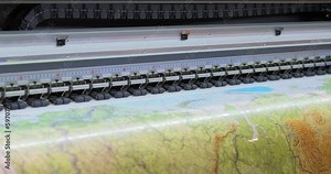 Modern Digital Large format UV printer. Printing production technologies. UV pinning is the process of applying a dose of low intensity ultraviolet light to a UV curable ink