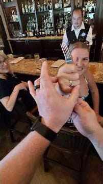Mind reader uses psychokinesis to bend a fork with mind over matter at Disneys Nomad Lounge.