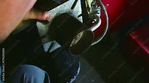 Assemblying gas burner back together after servicing ignition electrode. Screwing back burner tube to housing. In slow motion hd.