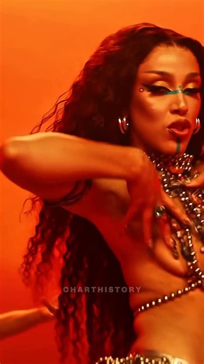 Charthistory on Instagram: "#CHUpdates: #OnThisDay 4 years ago ▶️ #DojaCat released “Woman” as the 4th single from her ‘Planet Her’ album.🚨📈 _____ Released as part of Doja Cat’s third studio album #PlanetHer, #Woman blends Afrobeats, pop, and R&B while centering themes of divine femininity and feminism. The track features background vocals from Jidenna, who also co-wrote the song, and quickly stood out for Doja’s smooth melodic delivery. Critics drew comparisons to #Rihanna—whom 