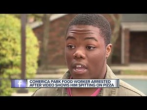 Comerica Park food services employee seen spitting on pizza in police custody