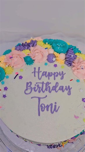 This birthday cake features happy colors and various piped details. Happy Birthday, Toni! | Buttercream Angel