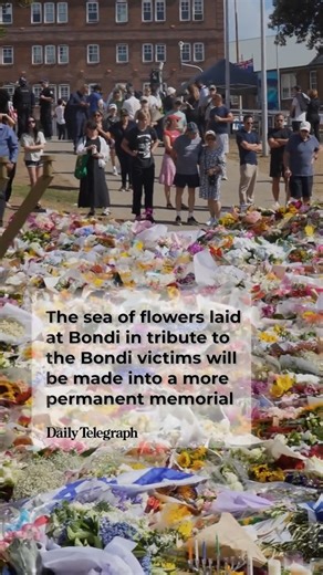 Teams worked through the morning to carefully clear thousands of flowers, letters and tributes left at Bondi Pavilion. | Daily Telegraph