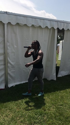 Live Performance by Male Singer at Outdoor Event