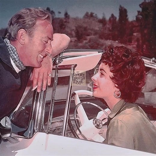 "Elizabeth Taylor and her husband, Michael Wilding, are photographed sharing a lighthearted conversation from the window of her car outside their Los Angeles home in 1955." | History Through Time