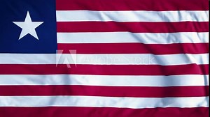 LIBERIA COUNTRY FLAG. A mesmerizing, ultra-slow-motion video of a high-quality flag gracefully waving in the wind, capturing every delicate ripple and fold in stunning detail.