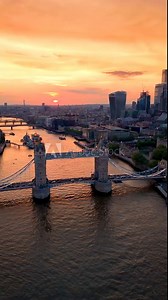 Aerial sunset summer view of the iconic Tower Bridge, River Thames and City skyscrapers in London, Englnd