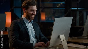 Night late job in company Caucasian businessman middle-aged adult man have fun riding seated on office chair start working with computer at desk professional worker male employee typing on pc keyboard