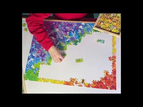 Time lapse of colorful jigsaw puzzle coming together