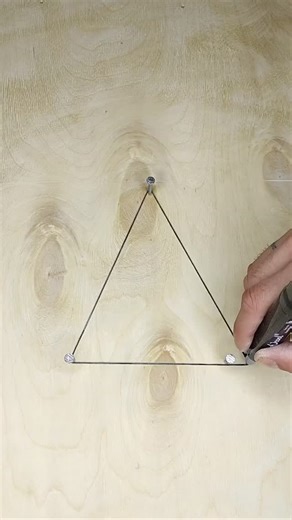DIY Mecha on Instagram: "Sometimes the simplest tools yield the most elegant results. Take this method for drawing an ellipse, for instance. It’s a classic geometric principle brought to life with just a few nails, a string, and a marker. You start by fixing two points, which will be the foci of your ellipse. The string provides the constant sum of distances from any point on the ellipse to these two foci. As you move the marker, keeping the string taut, the path it traces forms that perfectly s