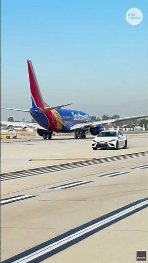 Terrifying video shows car almost hit plane on tarmac
