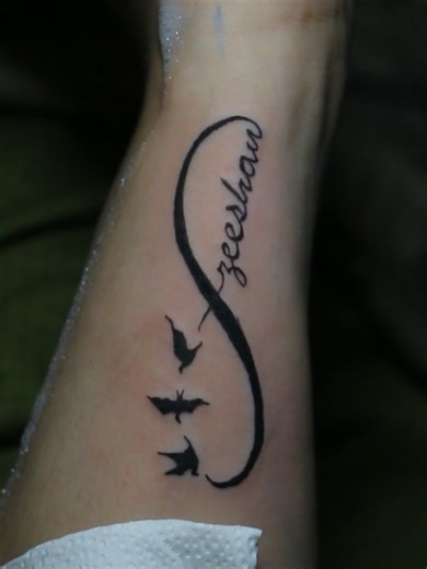 Infinity tattoos hit different when they carry a name. ❤️ From needle to stencil to final reveal, this one has meaning.🎨 DM or WhatsApp us for any inquiries: [0341-0866588] #infinitytattoo #meaningfultattoo #tattooreveal #tattooprocess #tattooartist