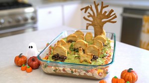 Make a ghoulish guacamole graveyard with tombstone chips for Halloween