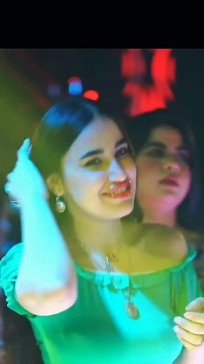 Women Dancing in Stylish Nightclub Setting