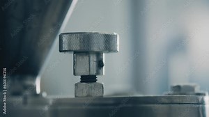 Automatic capsule filling machine, capsule filling device. Production line at a pharmaceutical company. The machine fills the capsule with contents. Production of drugs in tablets. Close up, DOF, 4K