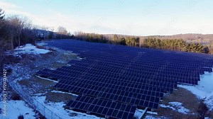 4k aerial view of solar panel farm converting solar power to electricity for green energy