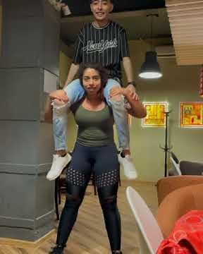 Egyptian strong woman lifts and squats a boy