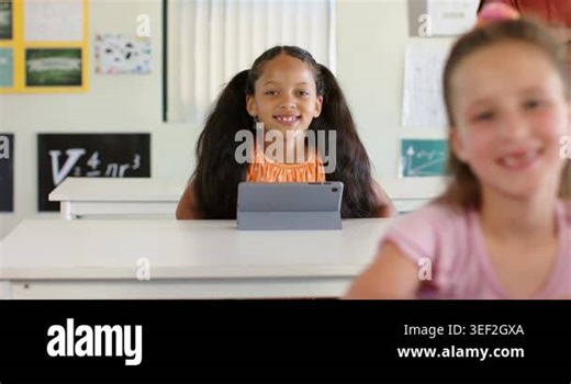 Camera refining focus, classmates in classroom watching youth female student learning with tablet. Education, school, teacher, device, board, posters, charts Stock Video Footage - Alamy
