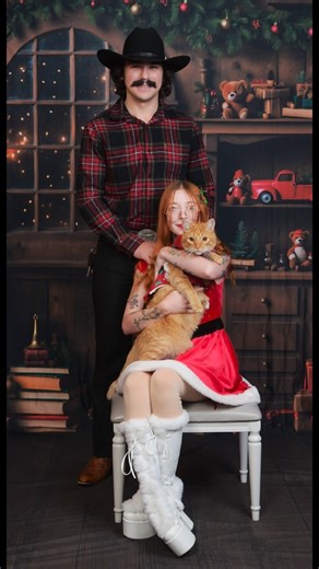 Trinity on Instagram: "J.C. Penney’s Christmas photoshoot with my cat Bumpkin and my husband 🥰🥰 Bumpkin was very distracted because there was a window behind the photographer with children playing on the other side 😆 as you guys know I have another cat but she is a lil too rambunctious because she is a kitten for something like this loll 💕#christmasphotoshoot #christmas #photography #tattooartist #cats @jcpenneyportraits"