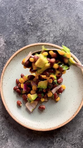 This Black Bean, Corn & Avocado Salad is an easy salad to make on busy days! Add the simple dressing made with olive oil, maple syrup, lime juice, salt and pepper and it’s ready to be enjoyed! 😋 Full recipe link in comments. #easyrecipes | Cook with Manali