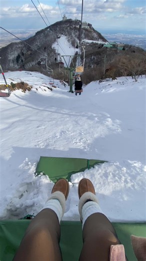 Ski Lift Ride Experience Over Snowy Mountains