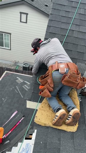 Laying over the edge to get this shingle in place! 😳 #roofing #construction