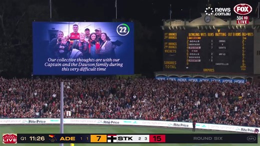 Jordan Dawson reacts as crowd pays tribute to dead brother
