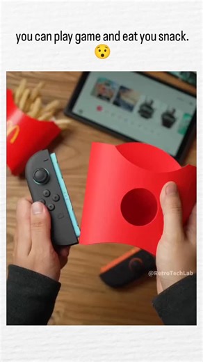 epi_chub_ on Instagram: "The post shares a 30-second video from showcasing a 3D-printed McDonald's fries holder that clips onto a Nintendo Switch, allowing seamless gaming and snacking with games like Mario Kart visible in action. Designed in free software like Bambu Studio and printable on consumer 3D printers, the accessory transforms a standard fast-food container into a controller grip, emphasizing accessible DIY fabrication for niche lifestyle hacks. With 2.3 million views and hundreds of r