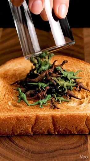 tasty dino bread spread 🤤🤯😲 #asmr #satisfying #asmreating #shorts #trending