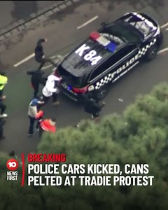 22K views · 162 reactions | #Breaking: Protesters have hurled drink cans and kicked police cars during a protest against mandatory COVID-19 vaccinations in the construction sector. Men in high-viz gear could be seen attacking the cars in Melbourne's CBD, before an undercover police vehicle sped through the crowd of protesters. | 10 News Melbourne | Facebook