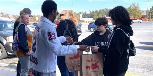 Local business gives back by giving away bags of free food