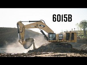 Caterpillar 6015B Excavator Loading 777 Trucks