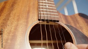 Wave Motions of Strings on a Wooden Guitar Captured by a Fast Shutter Speed Camera, Close-Up.