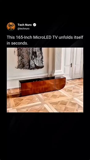 Tech Nuro on Instagram: "What appears to be a solid wall transforms into a massive 165-inch screen within seconds. This MicroLED TV unfolds itself with precision, using modular panels that lock together seamlessly—no visible bezels, no compromises. Powered by MicroLED technology, the display delivers extreme brightness, true blacks, and exceptional color accuracy, all without the risk of burn-in. The engineering behind the unfolding mechanism ensures perfect alignment every time, making the tran