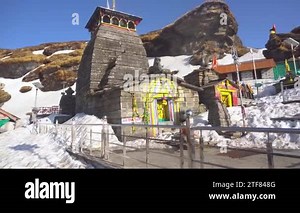 Pilgrims at Tungnath Lord Shiva temple with low clouds, time lapse hyperlapse, Himalaya, India, Uttarakhand 4k - 20.05.2022