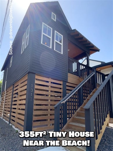 Would you live in this 355-sqft foundation tiny house near the beach? 🏡 Inside, this tiny house features an open floor plan with a living room, a kitchen with full-size appliances, a dining nook, a main-level bedroom with a small closet, a bathroom with a tile shower, a bonus loft bedroom, front & back porches, & an incredible outdoor living setup underneath with a movie projector & bartop for entertaining! My favorite part is the outdoor living area underneath the home! What about yours? #tiny