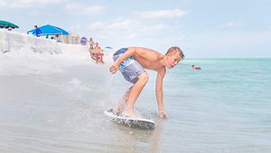 Learn how to skimboard without breaking the bank (or your wrist)