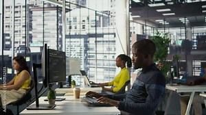 Happy coworker in wheelchair bumping fists with programmer testing machine learning technology. Person with disability saluting colleague in inclusive office, doing friendly gesture, camera B